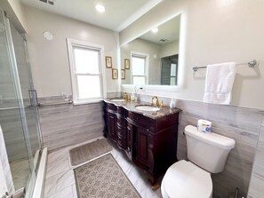 Bathtub, hair dryer, towels, soap