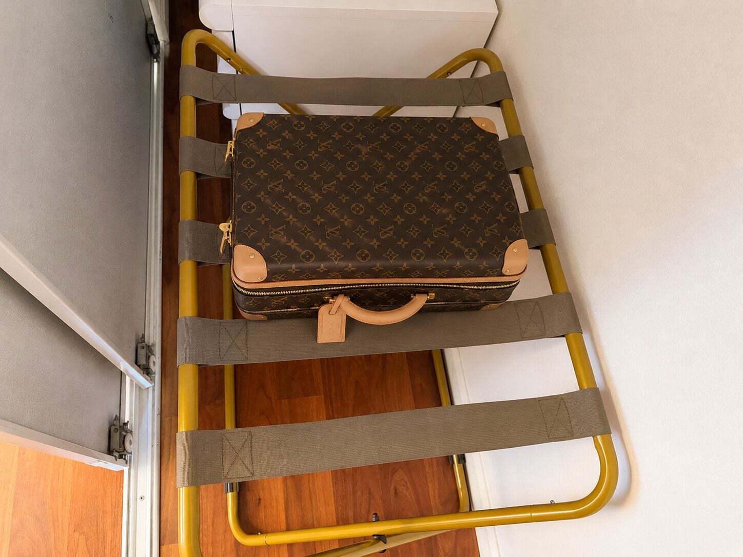 A suitcase on a luggage cart.