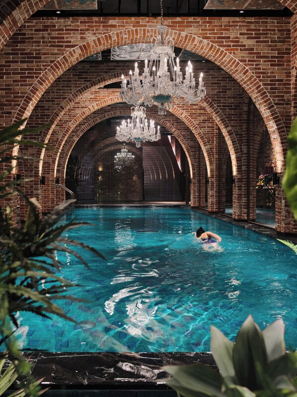 Indoor pool, seasonal outdoor pool, pool umbrellas, pool loungers