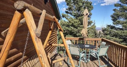 Location! Nice log home in dark sky community next to several peaks