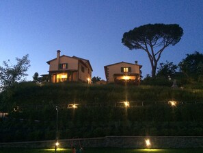 Two houses on a hill with a large tree in the background. - Farfalla di Toscana:  privacy, pool, amazing views (Toscana)