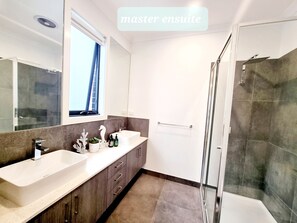 Combined shower/bathtub, hair dryer, towels, soap