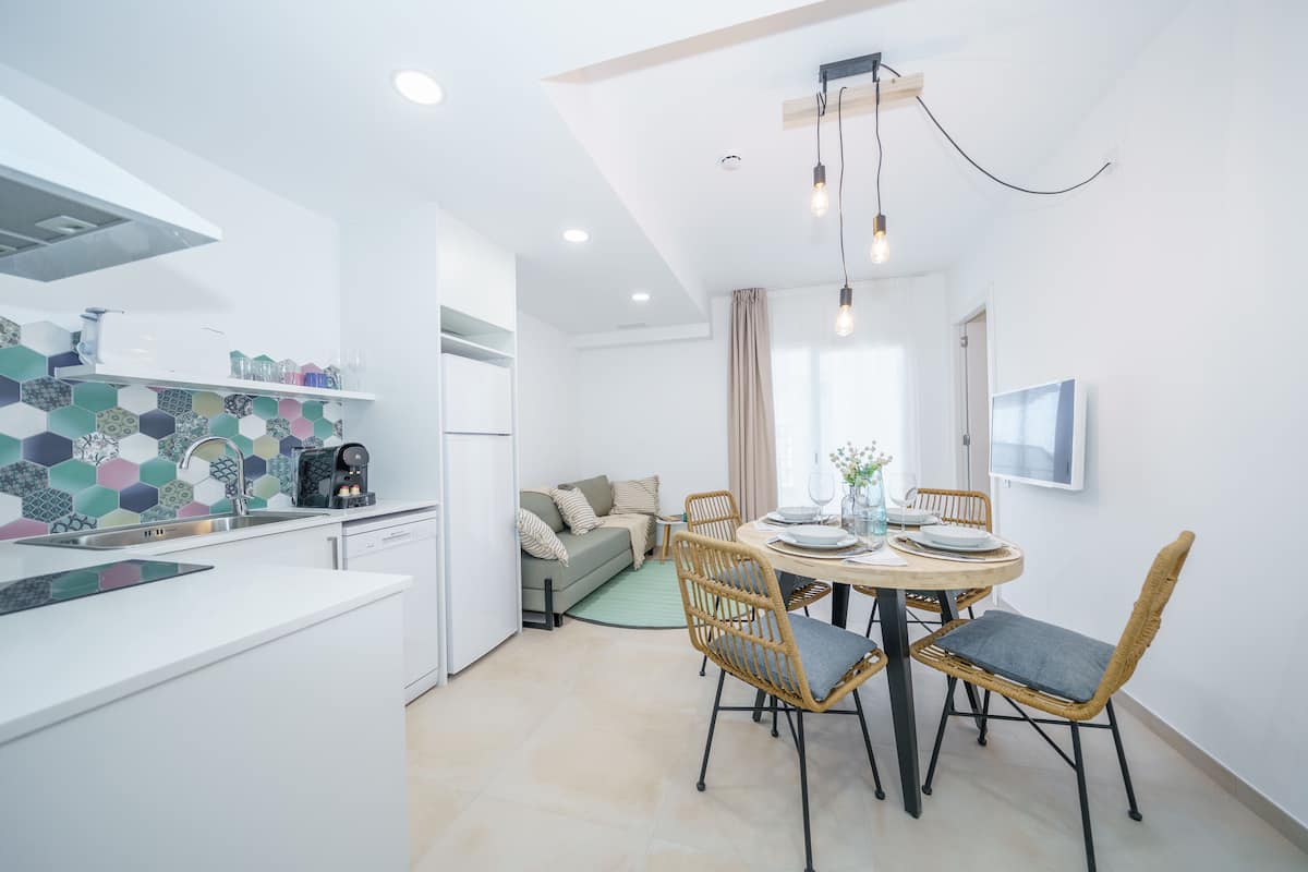 Comfort Apartment, 1 Bedroom, Balcony, Garden View | Living area | 39-inch Smart TV with cable channels, TV, streaming services