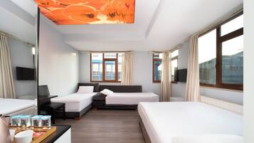 Standard Triple Room | Minibar, desk, laptop workspace, iron/ironing board