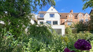 A residential area with a house featuring a pitched roof, multiple windows, and a visible chimney. - No.192 Oxford (Oxford)
