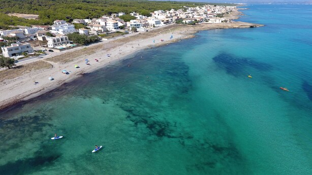 An aerial view of a coastal town with a beach, clear waters, and buildings along the shore. - PICAFORT2, PRIVATE POOL, free wifi, beach, air conditioning, barbecue (IB)
