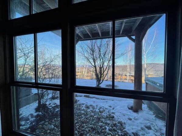Guests can enjoy a serene view of the surrounding landscape from this room.