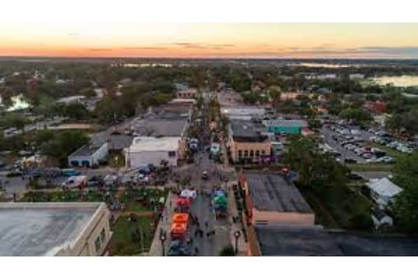 Explore the charming town's main street, lined with shops and businesses.