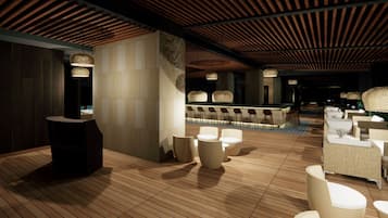 Relax in a stylish lounge area with round tables and comfortable seating, featuring a reception desk and modern decor.