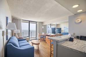 Deluxe Suite, 1 King Bed with Sofa bed | Living area | 40-inch flat-screen TV with cable channels, TV, DVD player