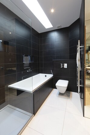 Bathtub, hair dryer, towels, soap
