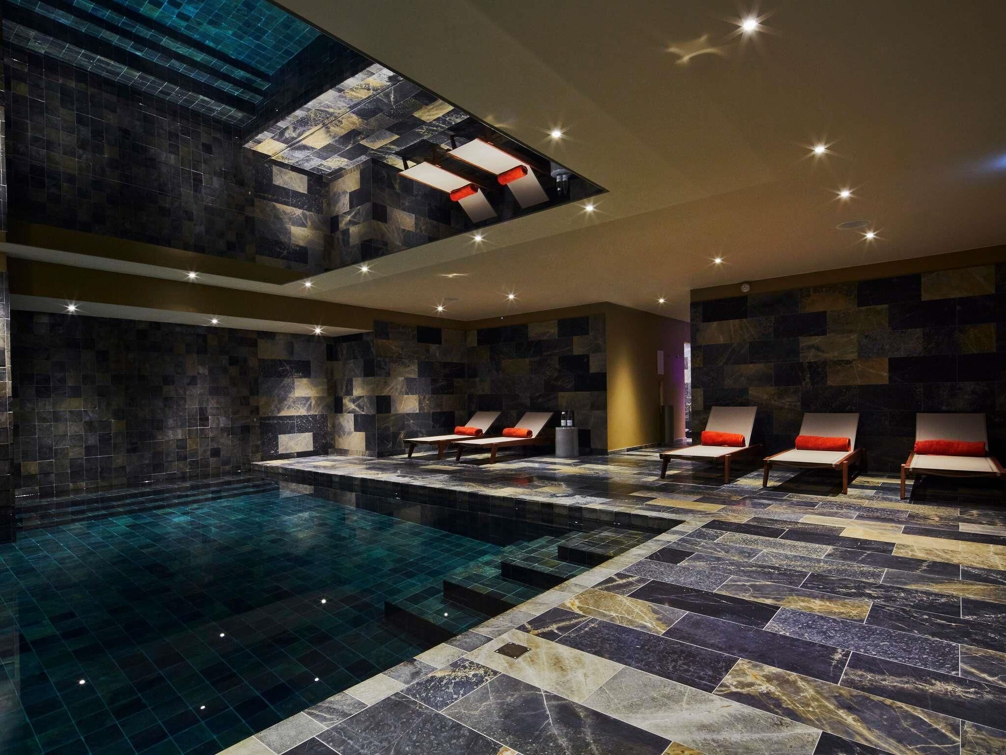 Indoor pool, open 9:00 AM to 8:00 PM, pool loungers