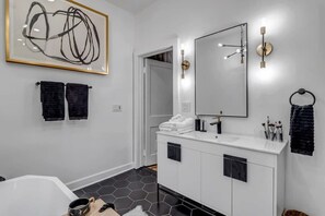 Bathtub, hair dryer, towels