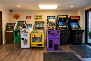 A row of arcade machines including After Burner, Arcade Legends, and The Simpsons, with signs indicating 'No Food or Drink' and 'Play More Win More'. - Walk to Beach, Spacious Backyard (Lake Ariel)