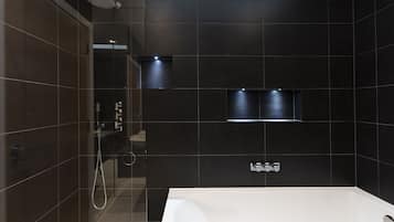 Bathtub, hair dryer, towels, soap