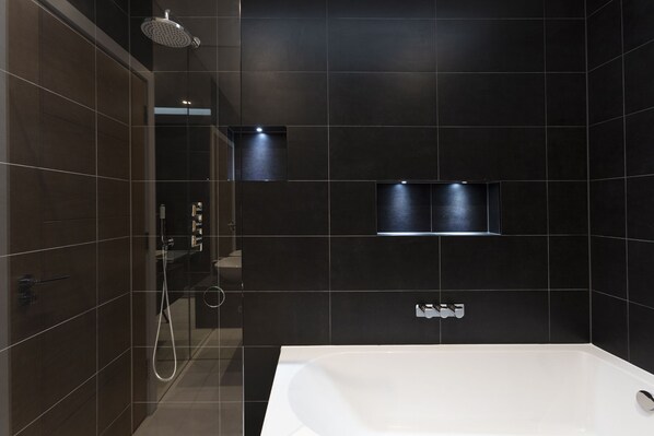 Bathtub, hair dryer, towels, soap
