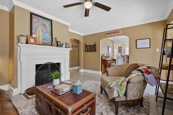 The front door is on the far right and the dining room and kitchen are through the arched doorway in the center. The piano was tuned last year and you are welcome to play it to your heart's content.