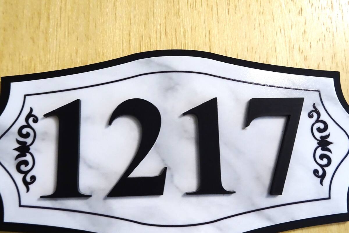 A house number sign with the number 1217.