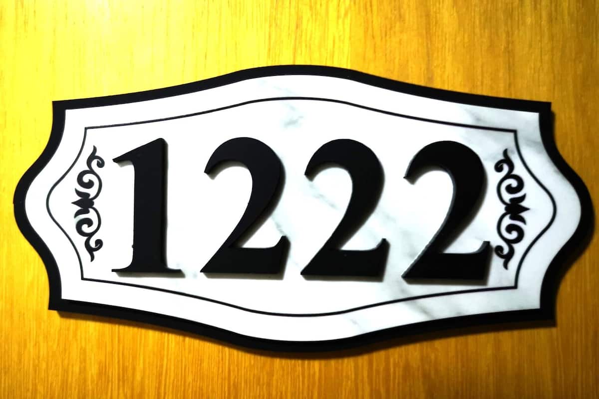 A house number sign with the number 1222.