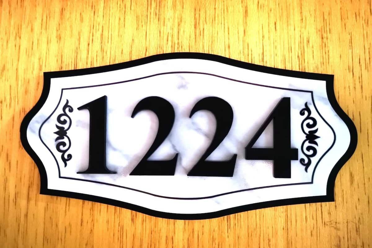 A house number sign with the number 1224.