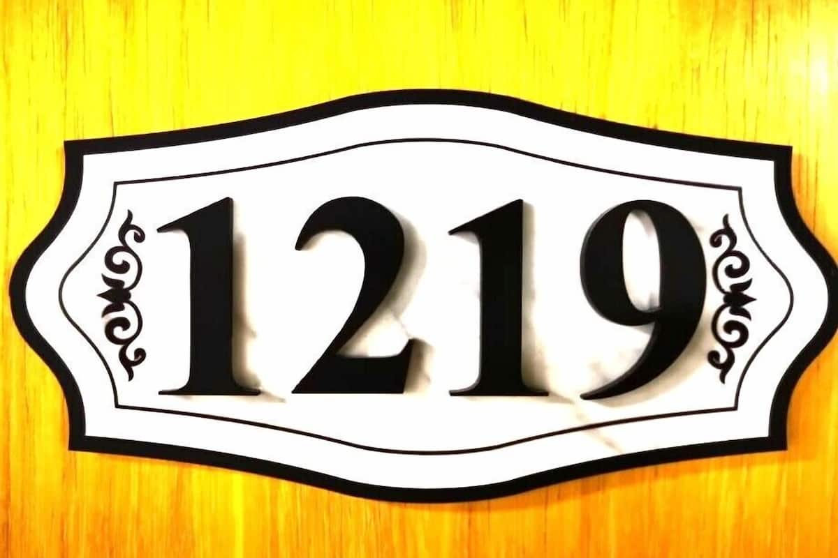 A house number sign with the number 1219.