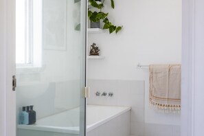 Bathtub, hair dryer, towels