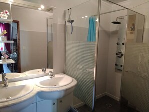 Shower, hair dryer, towels, toilet paper