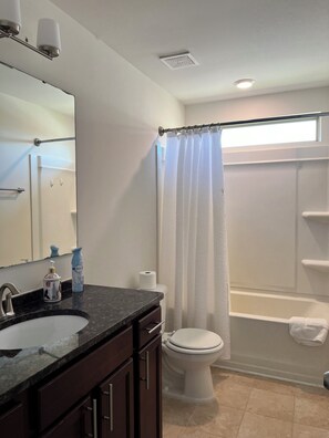 Combined shower/bathtub, hair dryer, towels, soap
