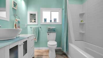 Bathtub, hair dryer, towels, soap