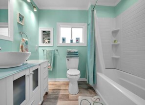 Bathtub, hair dryer, towels, soap