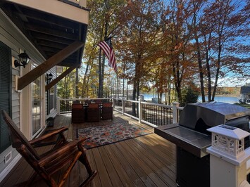 Furnished, composite deck that spans the front of the home on the main level