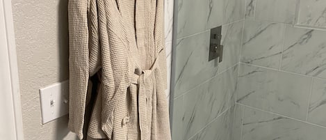 Bathtub, hair dryer, towels, soap