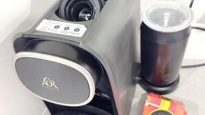 A coffee machine with a control panel displaying options like ristretto, espresso, and lungo.