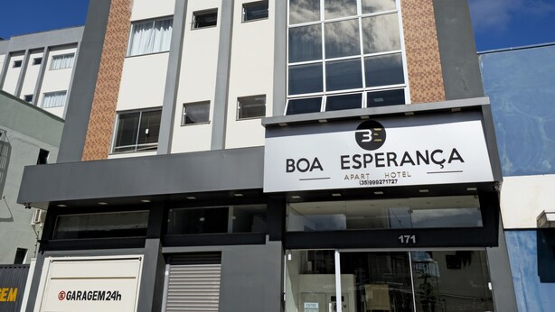 A modern hotel building with a prominent sign for Boa Esperança Hotel. - Boa Esperança Apart Hotel (Boa Esperanca)