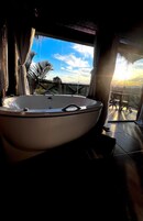 Romantic Bungalow, 1 Bedroom, Jetted Tub | Living area | Smart TV