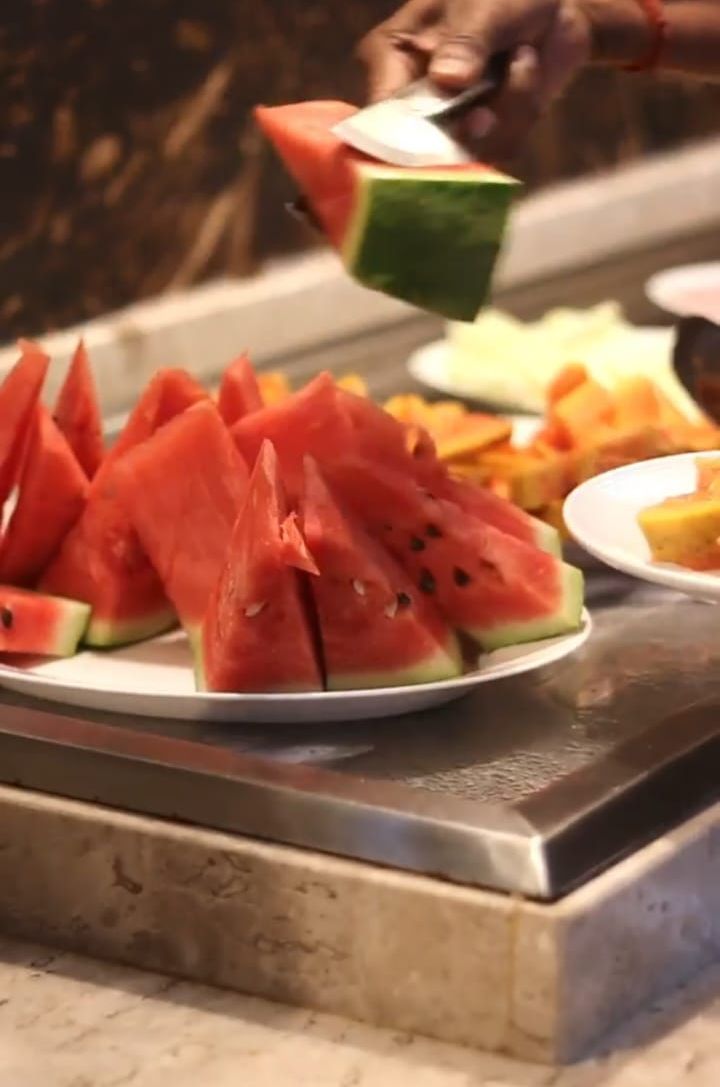 A plate of watermelon slices on a table.