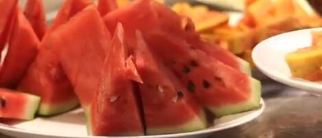 A plate of watermelon slices on a table.