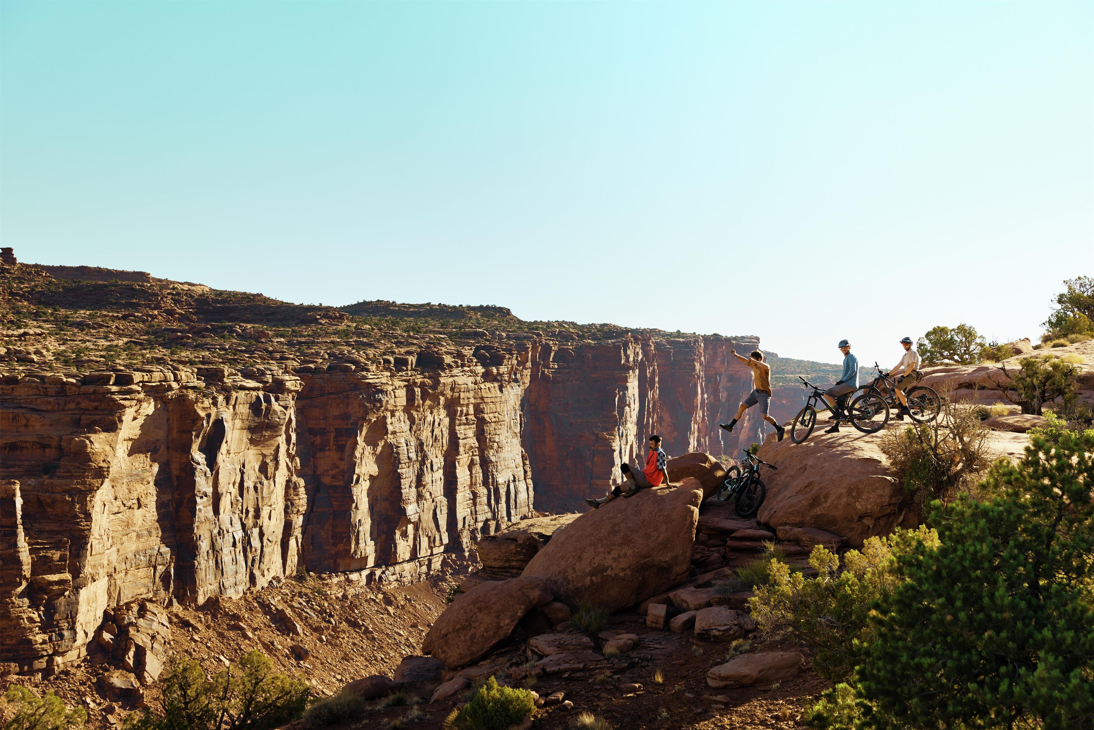 A canyon with rocky terrain and sparse vegetation.
