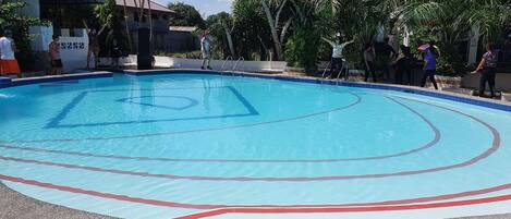 Outdoor pool, open 7:00 AM to 10:00 PM, sun loungers