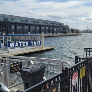 Docked at the pier, the water taxi offers convenient transportation.