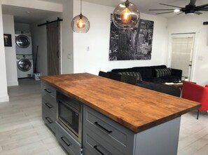 Enjoy cooking in this well-equipped kitchen with a stove and oven, perfect for preparing meals.