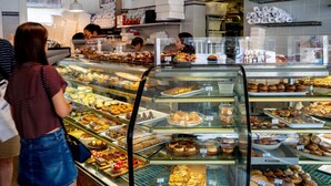 A bakery display case filled with various baked goods.