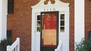 A brick building with a white entrance and the number 1110 above the door. - Homemade in HICKORY! Salt Water Pool!  (Hickory)
