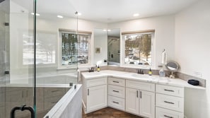 Combined shower/bathtub, hair dryer, towels, soap - The Powderhound Condo (Whitefish)