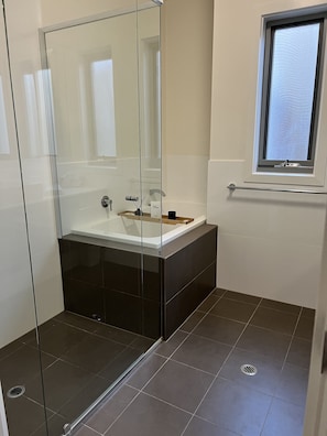 Combined shower/tub, hair dryer, towels, soap