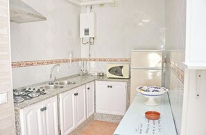 Fridge, microwave, cookware/dishes/utensils