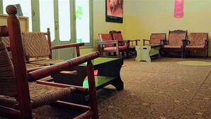 A room with a pool table, several chairs, and a patterned carpet. - Indus Hotel Shangla (Besham City)