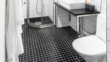 Deluxe Studio | Bathroom | Shower, hair dryer, towels, soap