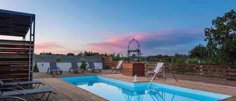 Seasonal outdoor pool, pool umbrellas, pool loungers