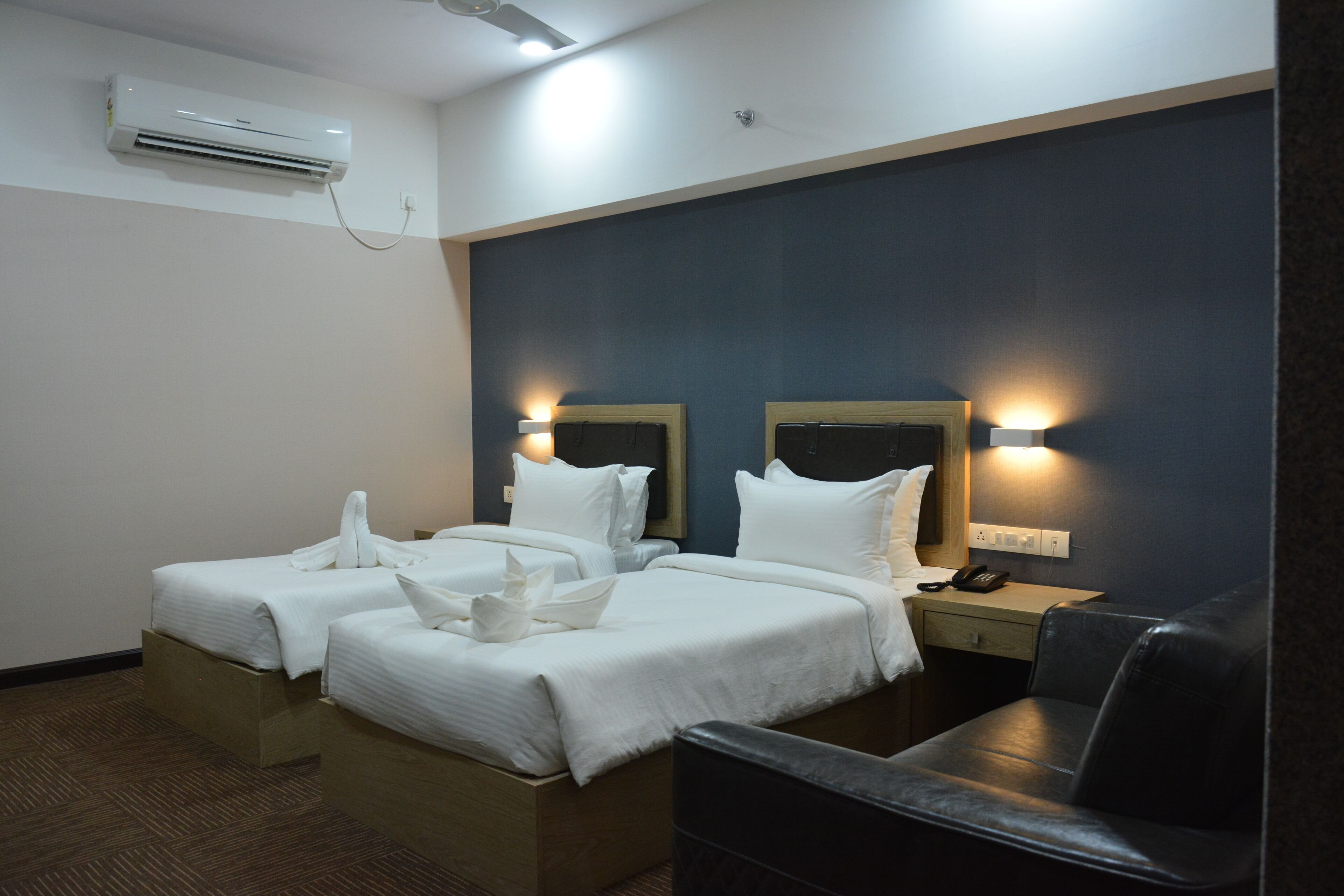 Premium bedding, memory-foam beds, desk, laptop workspace